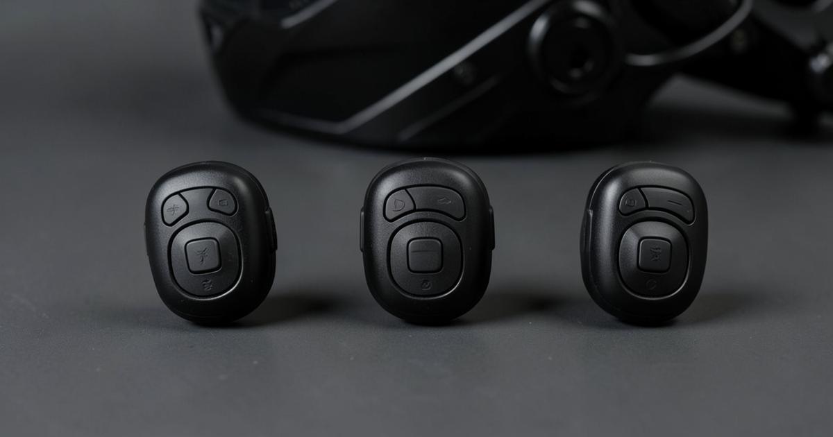 Three generic black budget motorcycle helmet intercom units arranged for comparison